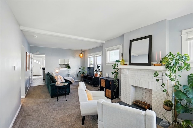 1708 Patterson Rd, Dayton, OH 45420 - living room featuring carpet, baseboards, and a brick fireplace