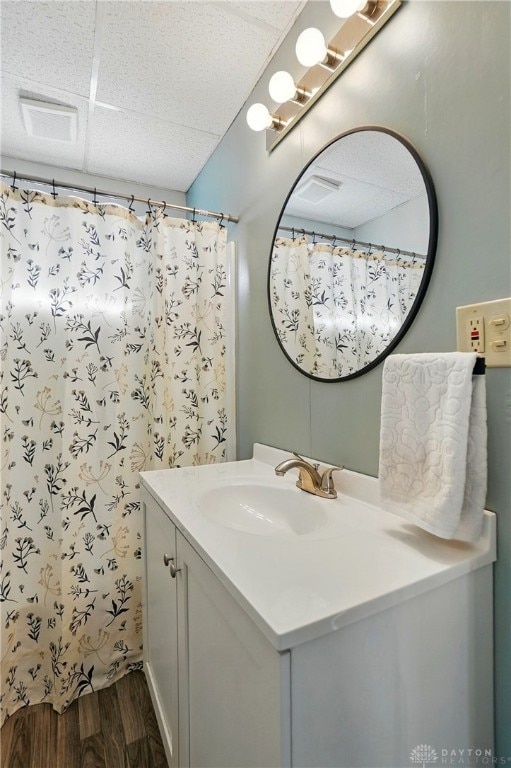 1708 Patterson Rd, Dayton, OH 45420 - bathroom featuring wood finished floors, vanity, and a shower with curtain