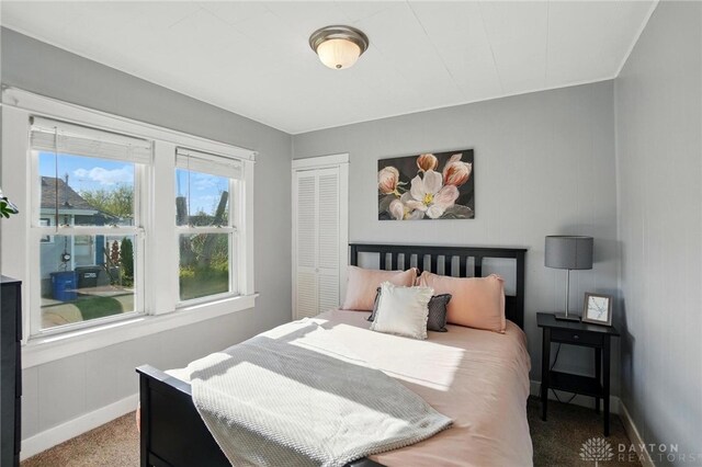 1708 Patterson Rd, Dayton, OH 45420 - carpeted bedroom with baseboards and a closet