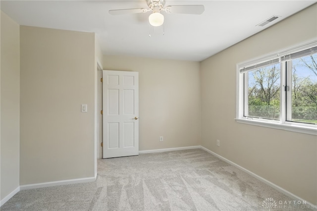 72 E Social Row Rd, Dayton, OH 45458 - empty room with light carpet, baseboards, and a ceiling fan