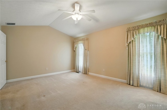 empty room with a ceiling fan, visible vents, and carpet floors