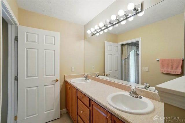 bathroom featuring double vanity and a sink