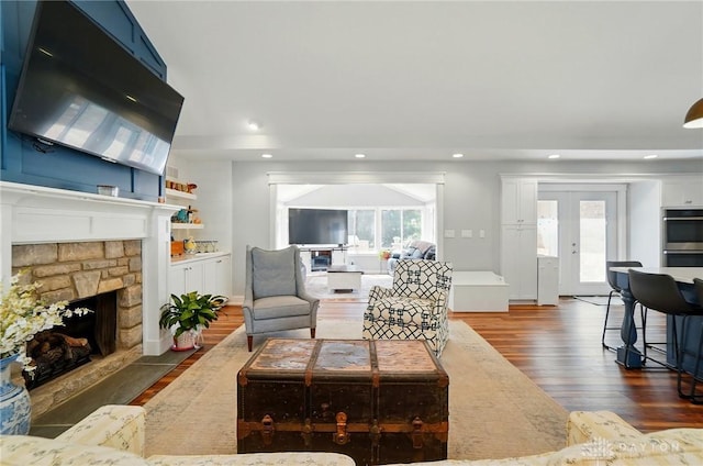 5017 Ackerman Blvd, Kettering, OH 45429 - living area featuring dark wood-style floors, a stone fireplace, and recessed lighting