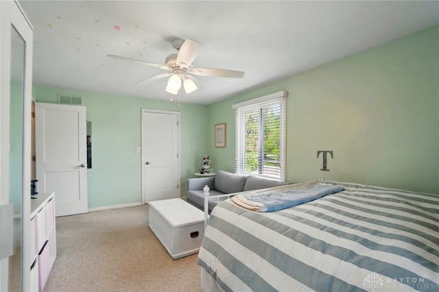5017 Ackerman Blvd, Kettering, OH 45429 - bedroom featuring a ceiling fan, light colored carpet, and baseboards