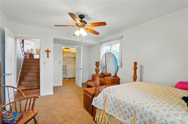 5017 Ackerman Blvd, Kettering, OH 45429 - bedroom with light carpet, a closet, a walk in closet, baseboards, and ceiling fan