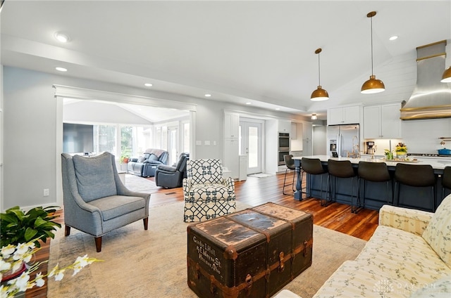 5017 Ackerman Blvd, Kettering, OH 45429 - living room with vaulted ceiling, wood finished floors, and recessed lighting