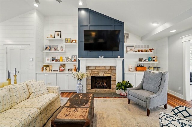 5017 Ackerman Blvd, Kettering, OH 45429 - living area featuring vaulted ceiling, light wood-type flooring, and a fireplace