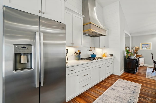 5017 Ackerman Blvd, Kettering, OH 45429 - kitchen featuring appliances with stainless steel finishes, premium range hood, dark wood-style flooring, light countertops, and white cabinets