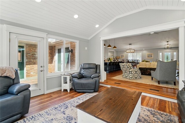 5017 Ackerman Blvd, Kettering, OH 45429 - living room with lofted ceiling, wood finished floors, recessed lighting, ornamental molding, and a chandelier