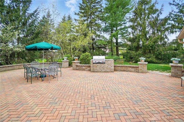 5017 Ackerman Blvd, Kettering, OH 45429 - view of patio with outdoor dining area and view of wooded area
