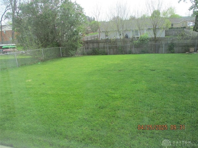 view of yard featuring a fenced backyard