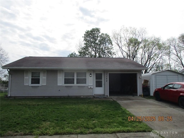 ranch-style home with a garage, a front lawn, and concrete driveway
