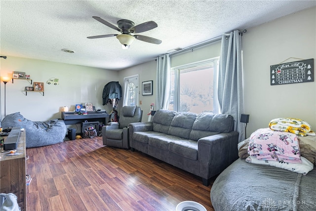 7351 Willow Dr, Blanchester, OH 45107 - living area with a textured ceiling, ceiling fan, visible vents, and dark wood finished floors