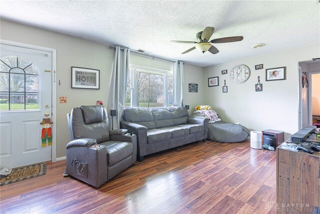 7351 Willow Dr, Blanchester, OH 45107 - living area featuring wood finished floors, a ceiling fan, and a textured ceiling