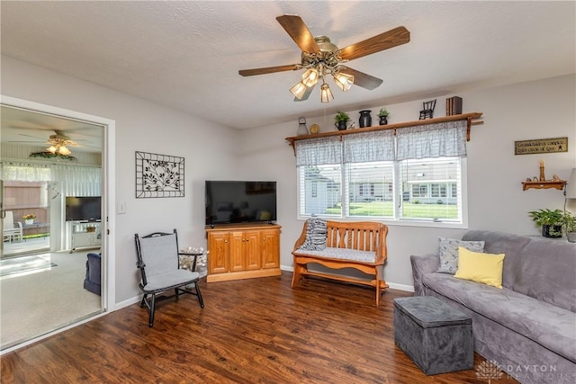 1823 Park Ave, Piqua, OH 45356 - living area with ceiling fan, dark wood-style floors, and baseboards
