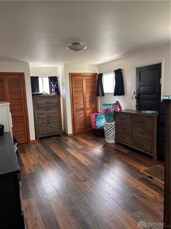 32 W 3rd St, West Alexandria, OH 45381 - bedroom with dark wood finished floors and multiple windows