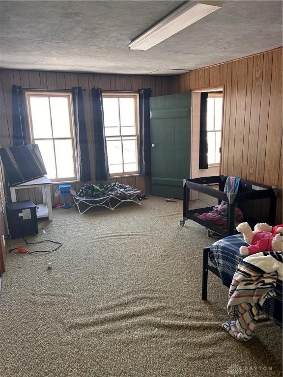 32 W 3rd St, West Alexandria, OH 45381 - carpeted bedroom with wooden walls