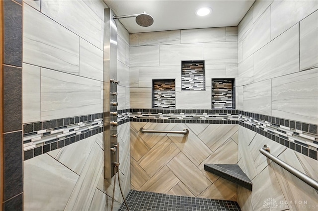 full bathroom featuring recessed lighting and tiled shower
