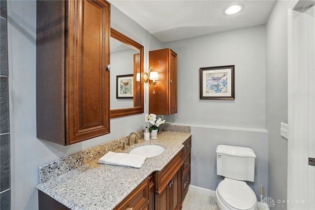 half bath with toilet and vanity