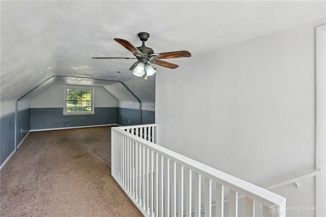 bonus room with carpet, ceiling fan, and lofted ceiling