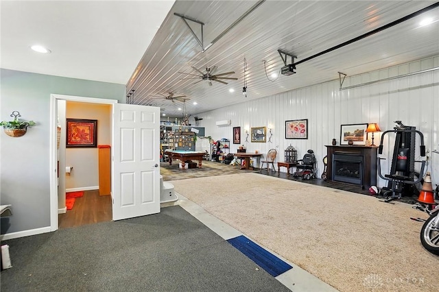 garage featuring recessed lighting, a ceiling fan, and baseboards
