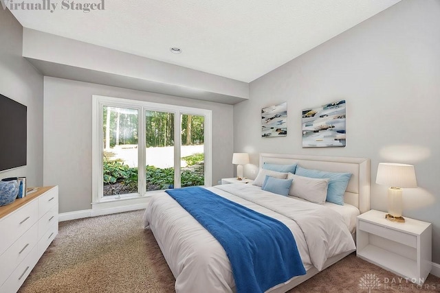 bedroom featuring baseboards and light carpet