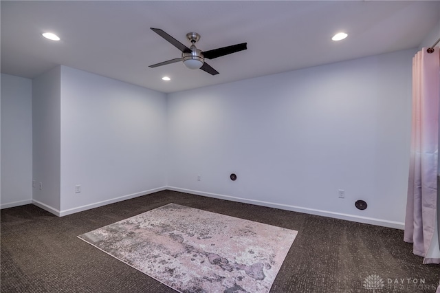 spare room featuring recessed lighting, baseboards, a ceiling fan, and dark colored carpet