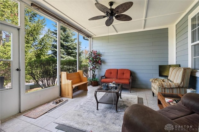 sunroom featuring a ceiling fan, a wealth of natural light, and outdoor lounge area