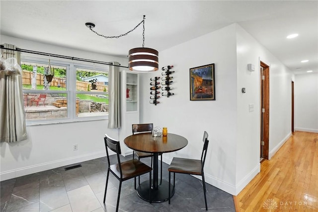 dining room with recessed lighting, visible vents, and baseboards