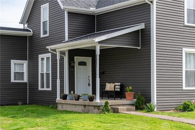 14 Clemens Ave, Jamestown Vlg, OH 45335 - entrance to property with a lawn, covered porch, and a shingled roof