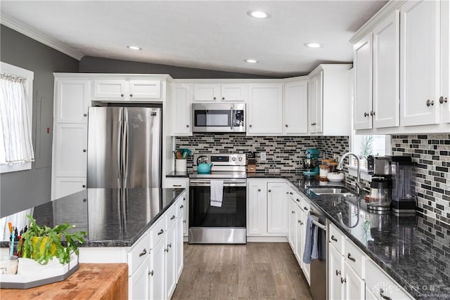 14 Clemens Ave, Jamestown Vlg, OH 45335 - kitchen featuring white cabinets, appliances with stainless steel finishes, decorative backsplash, and a sink