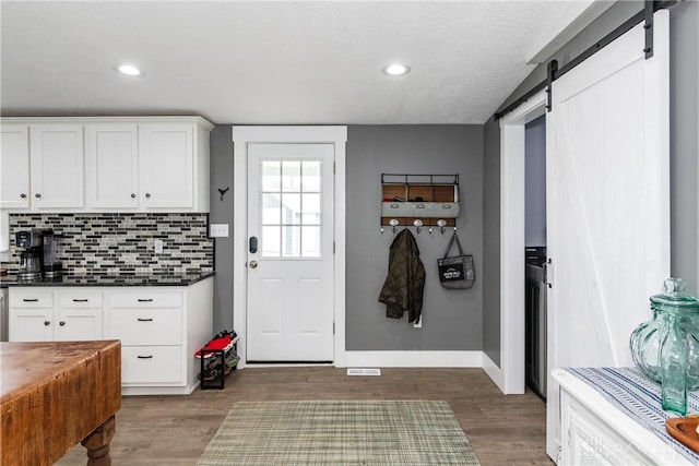 14 Clemens Ave, Jamestown Vlg, OH 45335 - mudroom featuring baseboards, a barn door, light wood-style flooring, and recessed lighting
