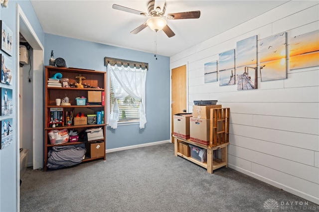 misc room featuring carpet flooring, baseboards, and ceiling fan
