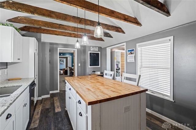 kitchen featuring white cabinetry, baseboards, butcher block counters, and dark wood-style floors