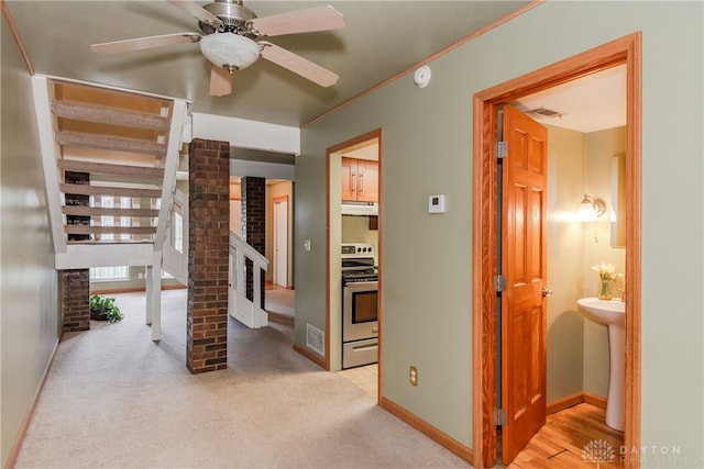 interior space featuring visible vents, carpet, and baseboards