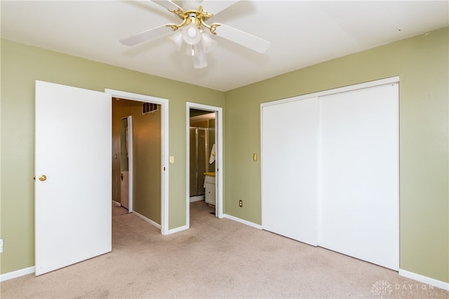 unfurnished bedroom featuring visible vents, baseboards, a closet, carpet, and a ceiling fan
