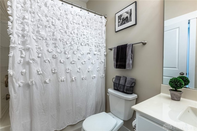 bathroom featuring toilet and vanity