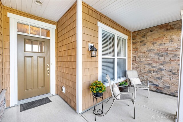 doorway to property with covered porch