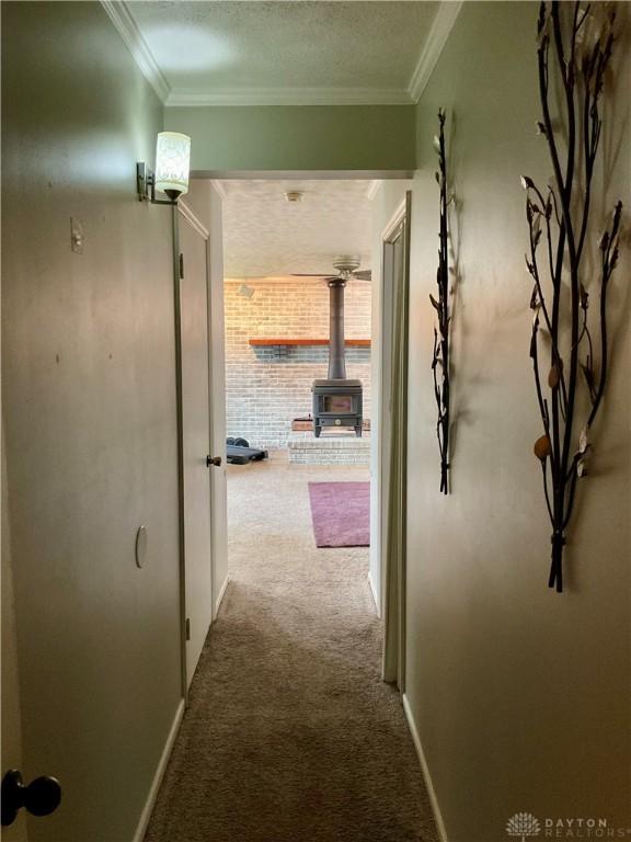 1331 Malden Ave, Springfield, OH 45504 - corridor with baseboards, a textured ceiling, crown molding, and carpet flooring