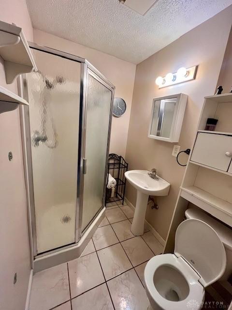1331 Malden Ave, Springfield, OH 45504 - bathroom featuring toilet, a textured ceiling, and a shower stall