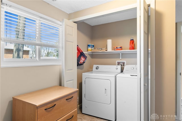 laundry room featuring washer and clothes dryer and laundry area