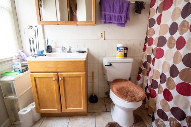 full bathroom with tile patterned floors, vanity, toilet, and curtained shower