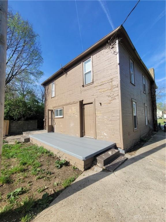 66 Barnett St Unit 64, Dayton, OH 45402 - back of house featuring brick siding
