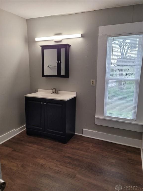 66 Barnett St Unit 64, Dayton, OH 45402 - bathroom with baseboards, wood finished floors, and vanity