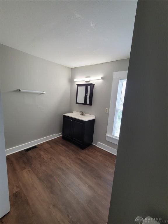 66 Barnett St Unit 64, Dayton, OH 45402 - bathroom featuring wood finished floors, baseboards, and vanity