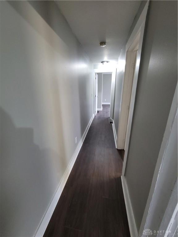 66 Barnett St Unit 64, Dayton, OH 45402 - corridor with dark wood-style floors and baseboards