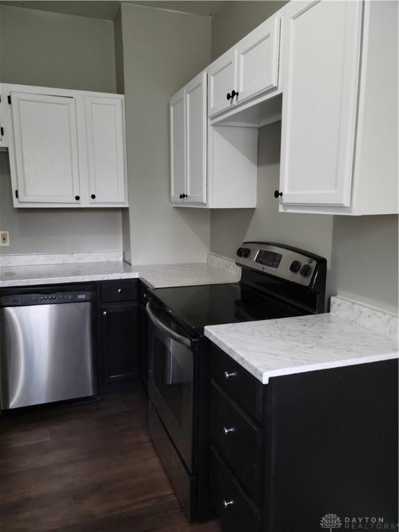 66 Barnett St Unit 64, Dayton, OH 45402 - kitchen featuring stainless steel appliances, white cabinetry, dark wood finished floors, and light countertops