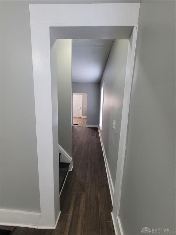 66 Barnett St Unit 64, Dayton, OH 45402 - hall featuring wood finished floors, an upstairs landing, and baseboards