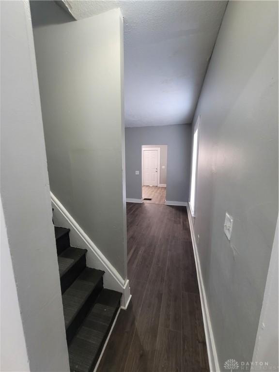 66 Barnett St Unit 64, Dayton, OH 45402 - stairs featuring baseboards and wood finished floors