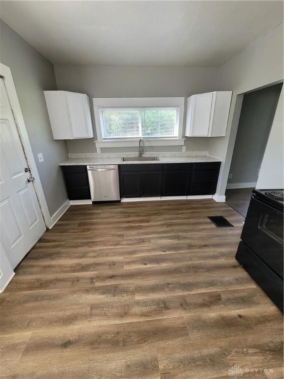 66 Barnett St Unit 64, Dayton, OH 45402 - kitchen with a sink, dishwasher, electric range, and white cabinetry